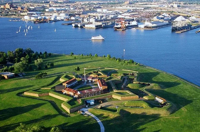 Aerial view of the five-pointed star fort on its green peninsula, with the harbor and city behind